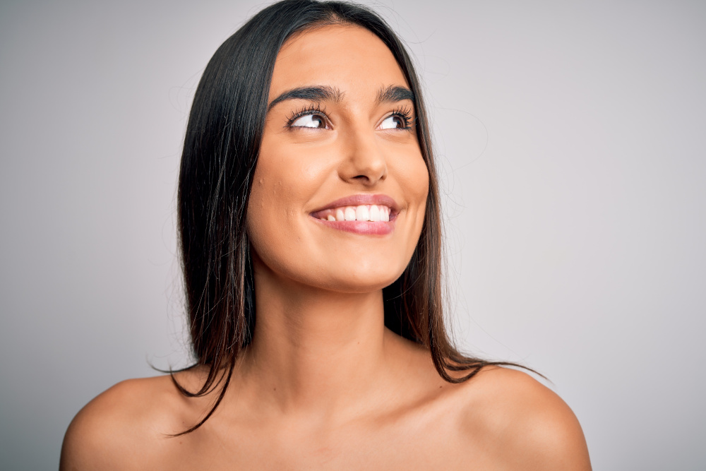 smiling woman gray background